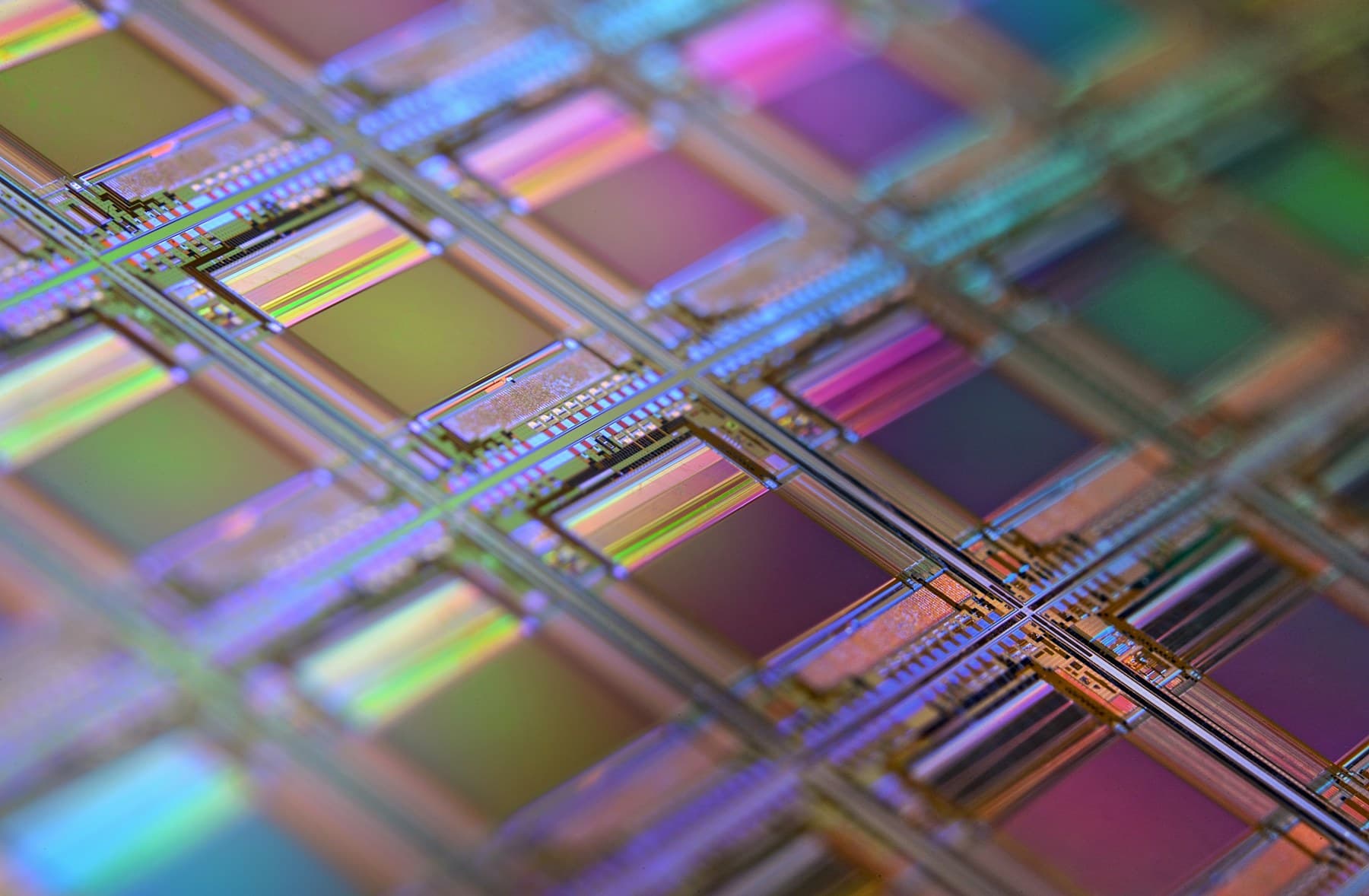 An iridescent silicon wafer with individual chip geometry visible