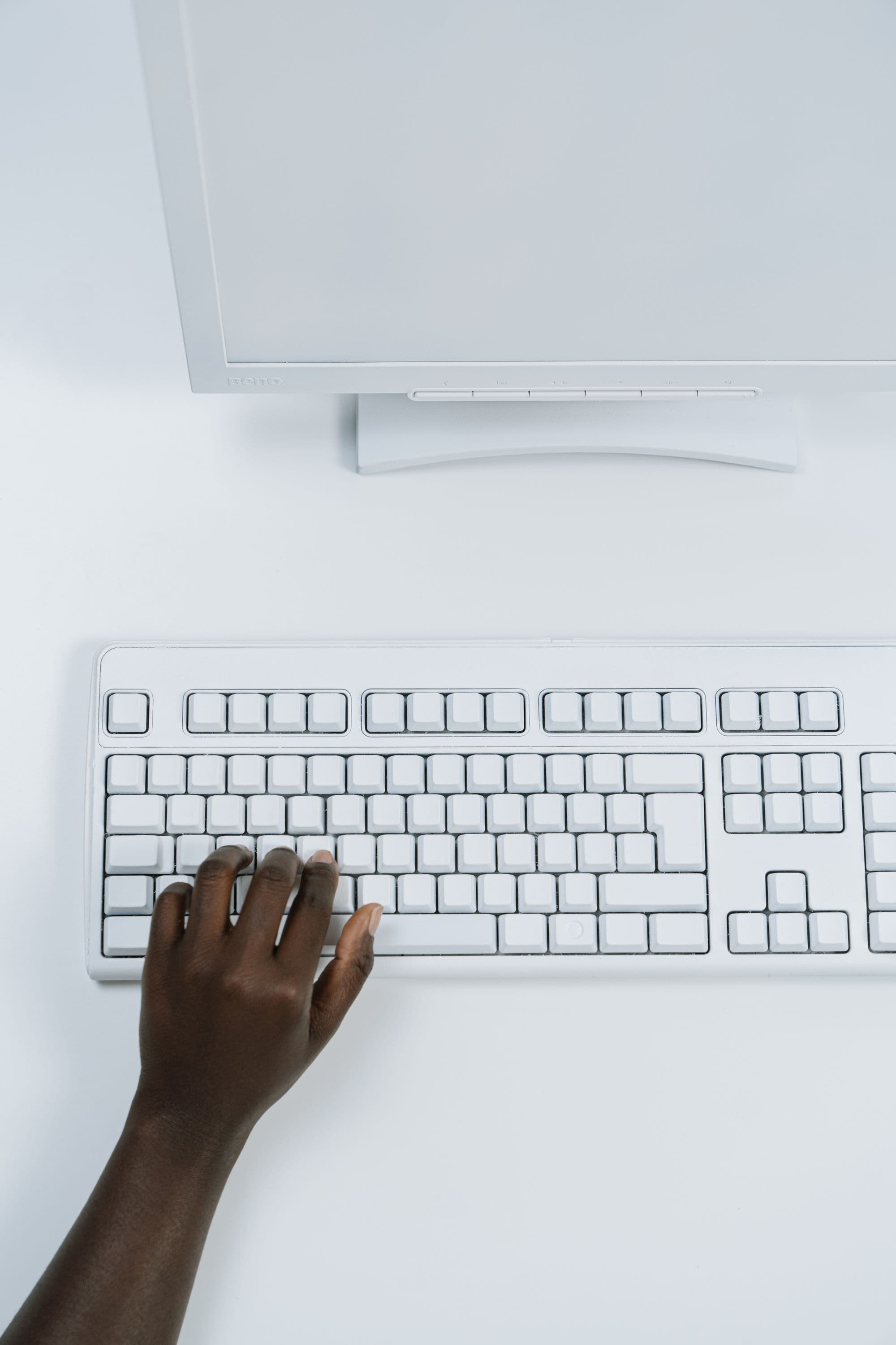 A white computer interface and keyboard in active use