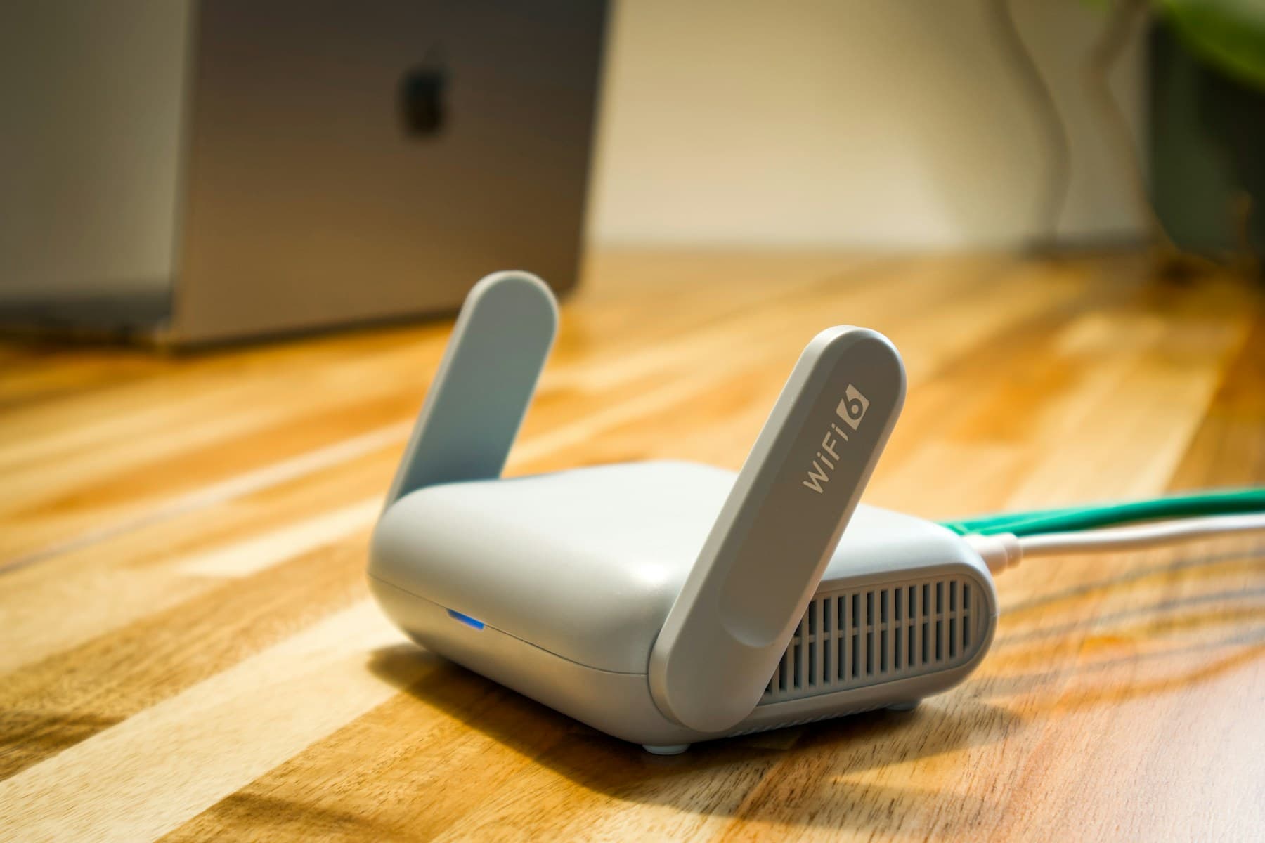 A compact network router at the edge of a workspace