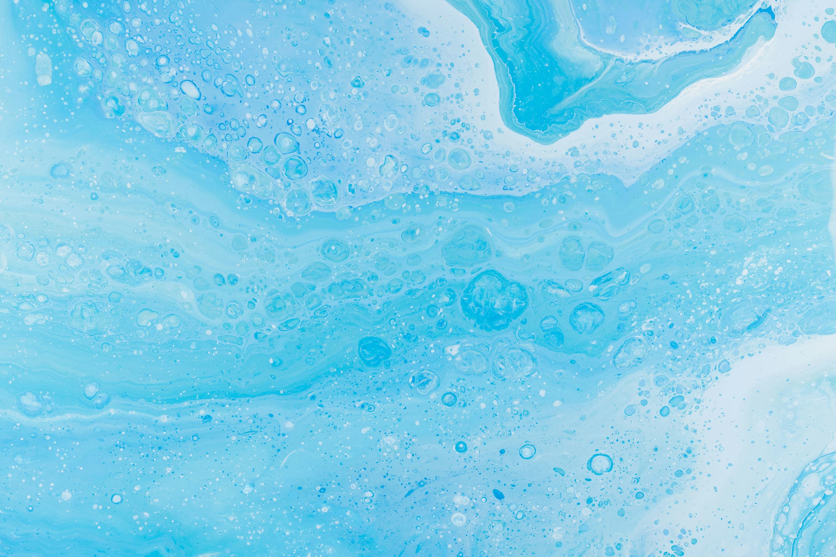 Blue water-like forms with reflective surface detail